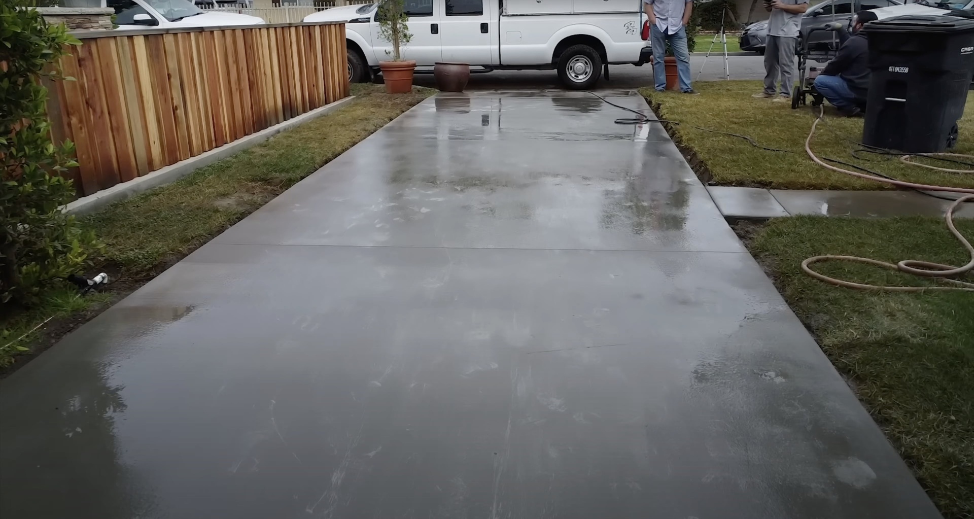 New Concrete Driveway Installation Project Fresh concrete driveway installation with professional finishing in progress