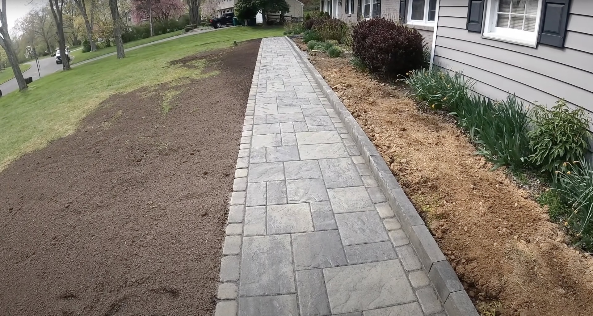 Decorative Stamped Concrete Walkway Stamped concrete walkway installation with decorative stone pattern